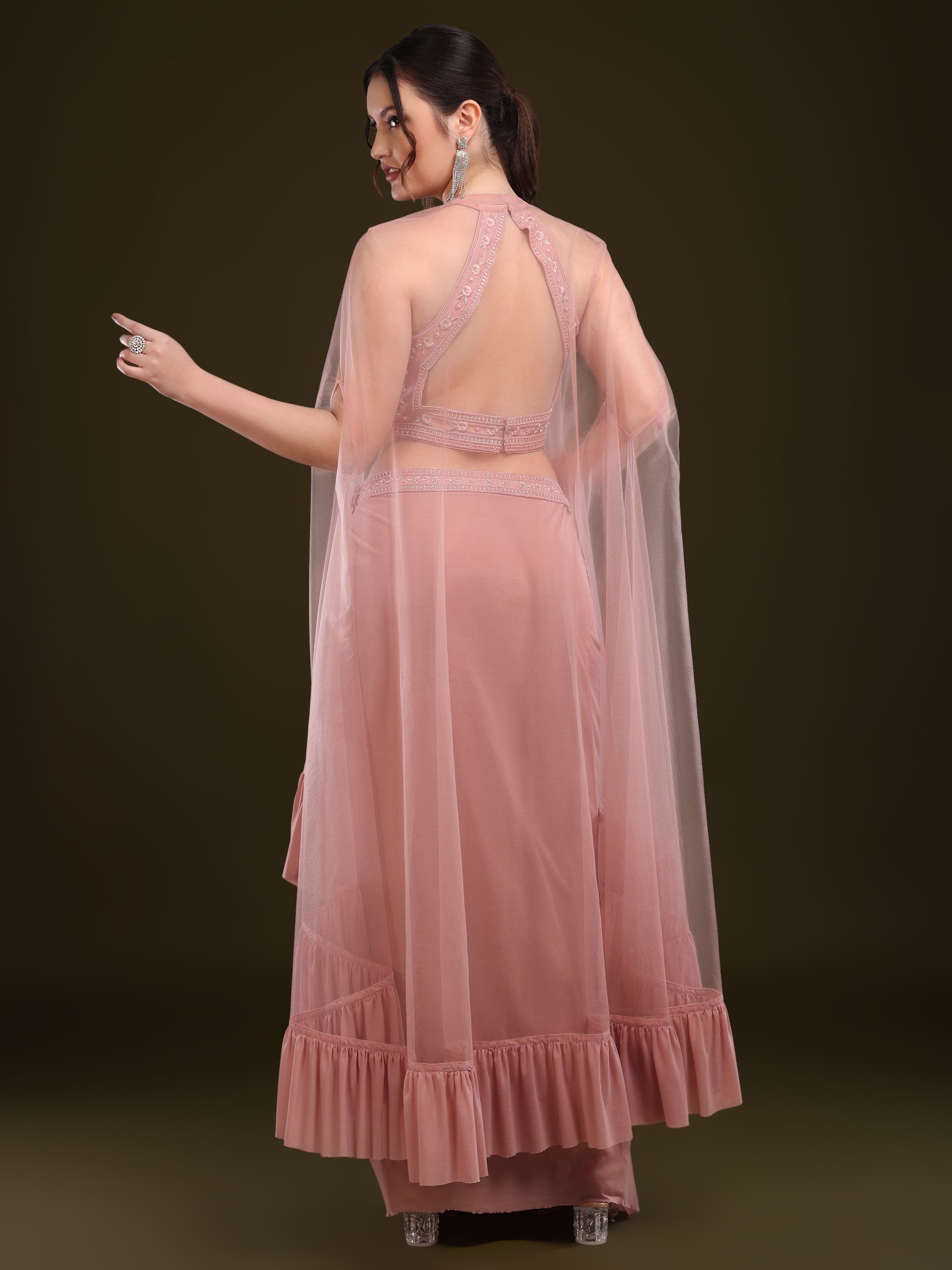 Back view of halter neck blouse and net cape with ruffle hem