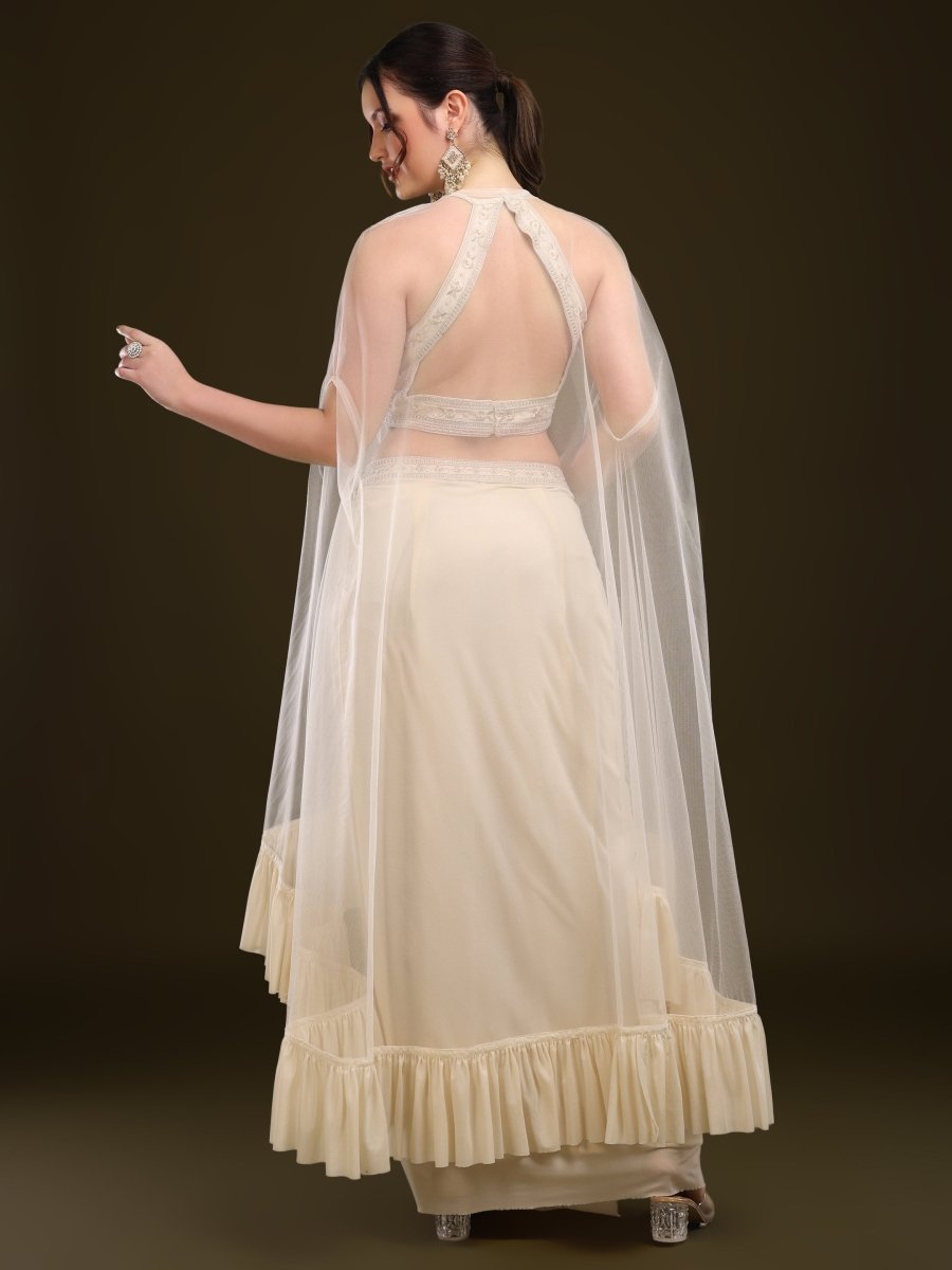 Back view showing tie-up and cape drape of rust blouse